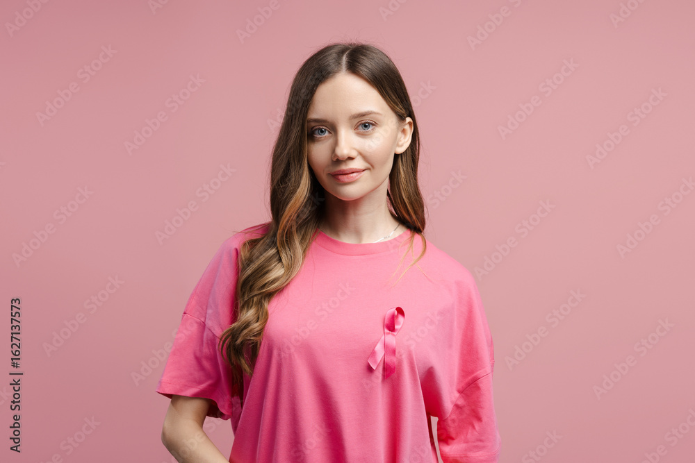 Fototapeta premium Woman wearing pink ribbon supporting breast cancer awareness month
