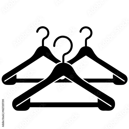 Three black clothes hangers arranged in a cluster on a white background