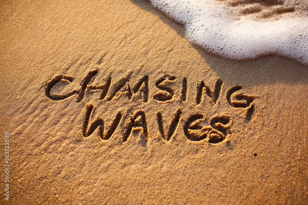 Fototapeta premium Chasing Waves Handwritten in Golden Wet Sand with Minimalist One-Line Art of Surfer Beside Text – Ocean Foam Near – Horizontal Coastal Art