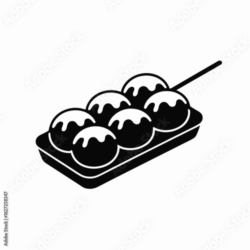 Delicious japanese takoyaki octopus balls served on a skewer in a tray