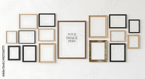 A gallery wall of various sized wooden and black frames hangs on a white wall, creating a minimalist yet stylish home decor arrangement.