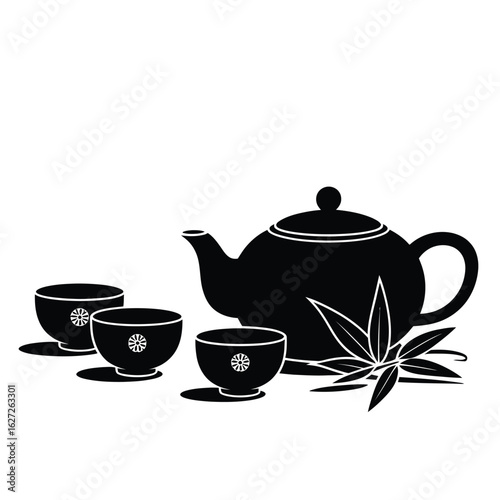 Traditional japanese tea ceremony set with teapot and cups and green tea leaves