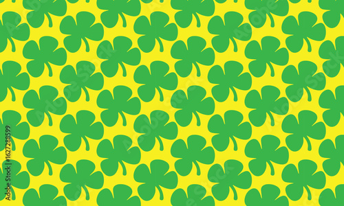 Seamless pattern with floral elements, green leaves, and clover, perfect for a spring or summer wallpaper design