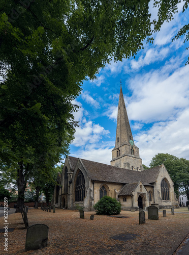Historic Gothic Church Surrounded by Lush Trees