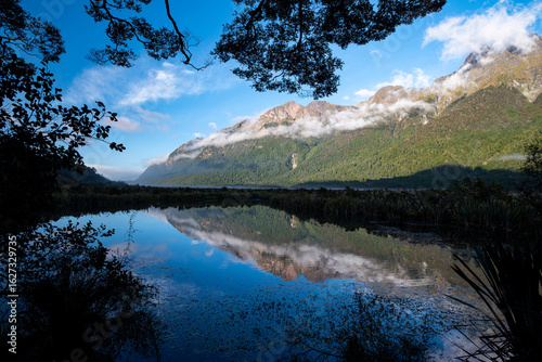 View of Earl Mountains reflecting on Mirror Lakes, New Zealand