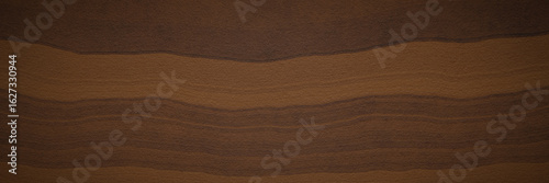 Abstract soil and rock background. Brown weathered layered stone surface texture