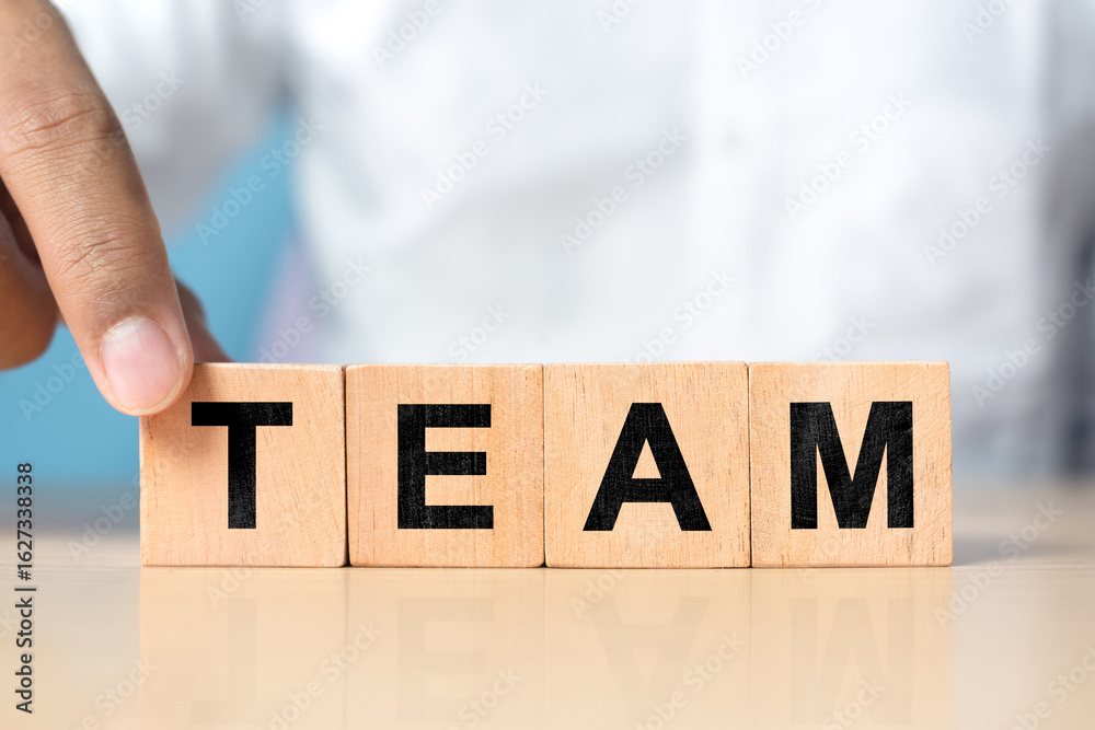 Naklejka premium Concept of team on wooden blocks