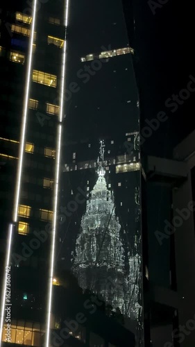 Malaysia, Kualu Lumpur - 05.07.2025 - Petronas Towers in the evening. A beautiful skyscraper in Asia, an incredibly tall building, a landmark in Malaysia. Evening shooting of skyscrapers