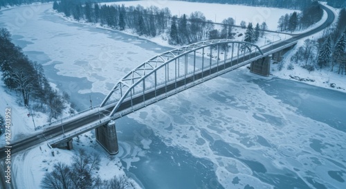 Aerial View: Winter Bridge Over Frozen River
