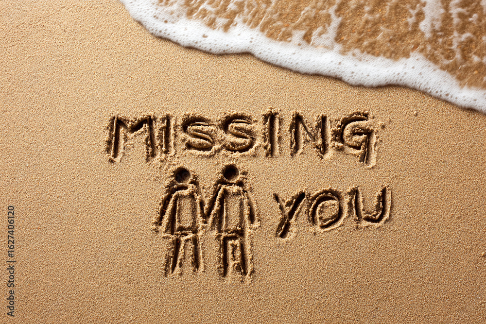 Fototapeta premium Missing You Handwritten in Smooth Wet Sand with Minimalist One-Line Couple Holding Hands Drawing Beside Gentle Wave – Horizontal Format for Romantic Posters