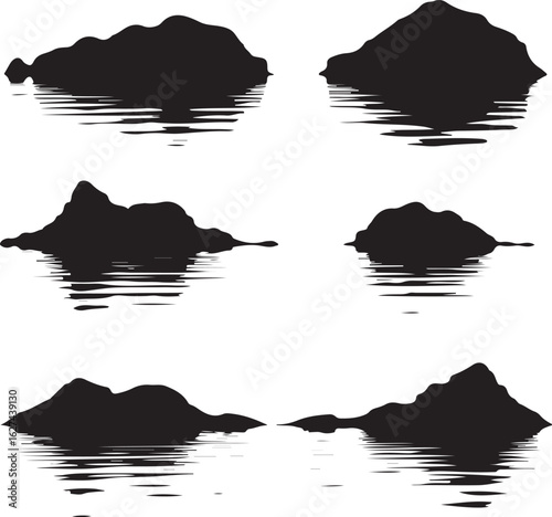 Black mountain silhouettes reflected in water reflection