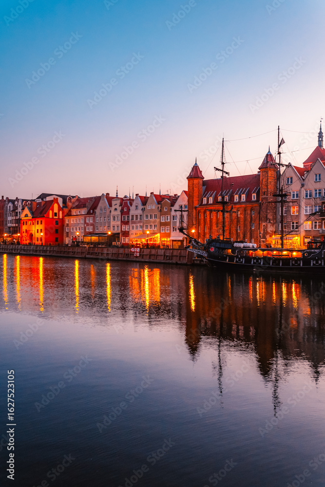 Obraz premium Gdansk with Motlawa river in Poland. Old town colourful house with Stragania Gate