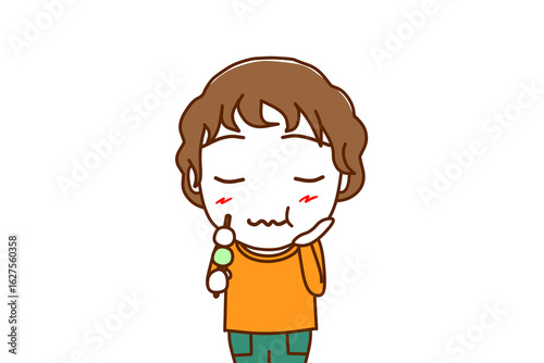 （上半身正面）三色団子を美味しく堪能し味わう白人少年