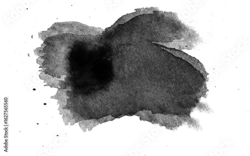 Foto A dark watercolor ink blot with surrounding splashes