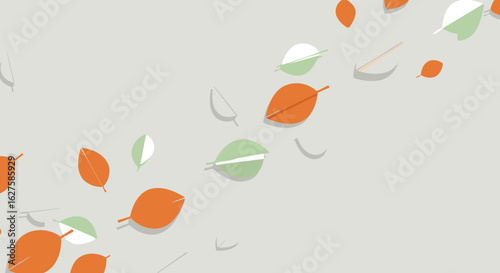 Autumnal leaves scattered on a light gray background. A flat lay design of colorful falling leaves in a neutral environment.