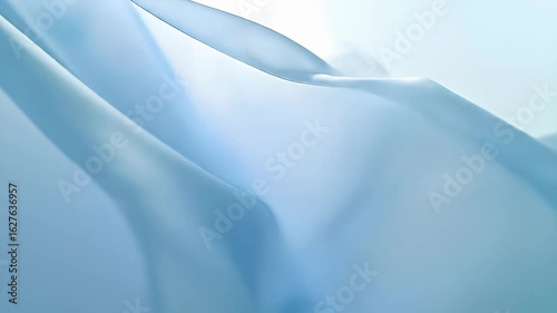 Soft, pastel blue fabric gently drapes and flows, creating a serene abstract