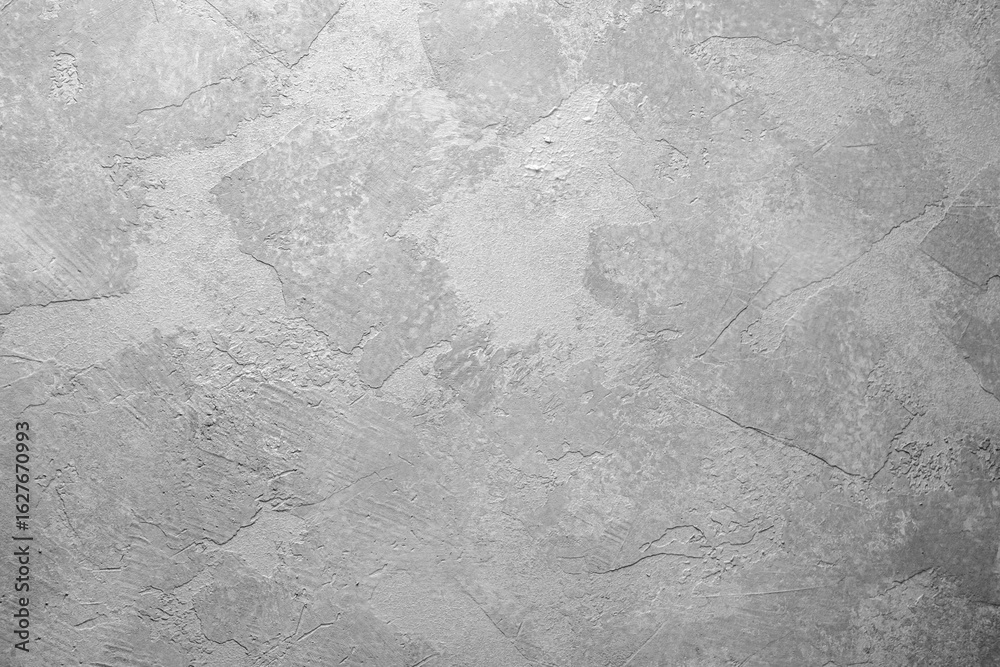 Naklejka premium Gray textured plaster wall with abstract background