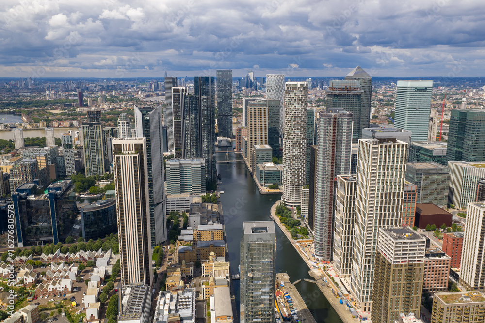 Naklejka premium Vertical cityscape showing Canary Wharf towers with Central London landmarks in the distance.