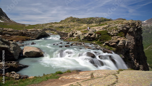 The Reculaz waterfall and a Roman bridge within the impressive Cirque des Evettes located above L'Ecot, Bonneval sur Arc, Vanoise National Park, Maurienne Valley, Savoie, Northern French Alps, France