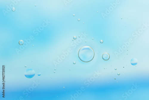 Wallpaper Mural Bright abstract macro view of bubbles rising in clear light blue water. Floating clear bubbles in fresh blue fluid background Torontodigital.ca