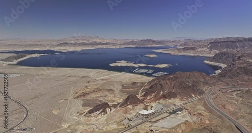 Lake Mead Nevada Aerial v8 flyover barren terrain, capturing a vast water body surrounded by arid desert landscapes and rocky mountains - Shot with Mavic 3 Pro Cine - Apr 16th 2024