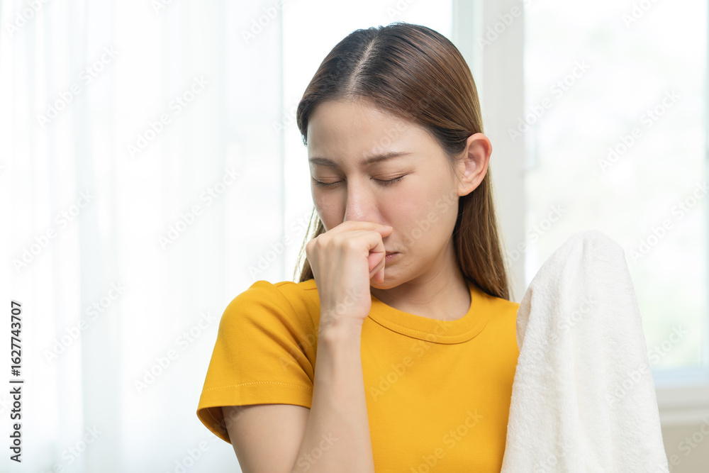 Young people doing laundry smelling for dirty clothes. Young people doing laundry smelling for dirty clothes.