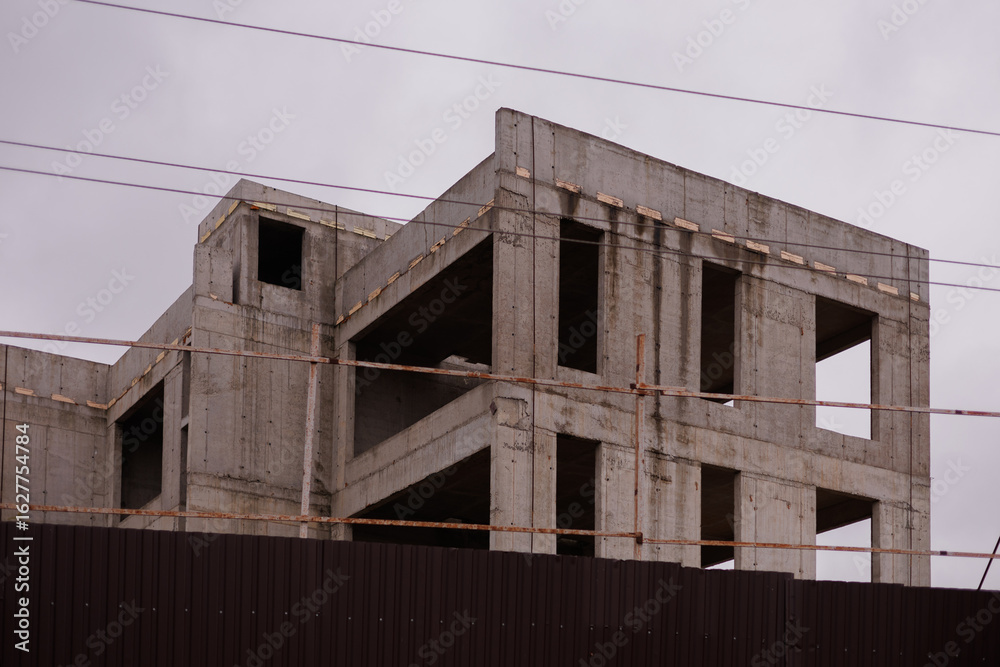 Construction of buildings, a multi-story building against the sky Construction of buildings, a multi-story building against the sky