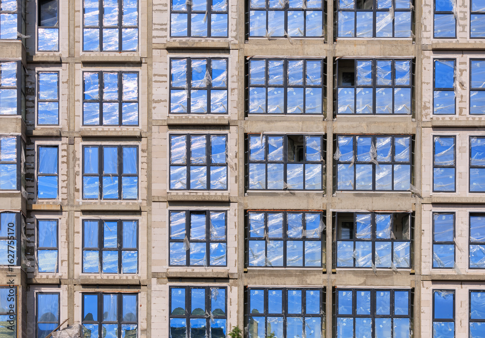 Fototapeta premium Construction of buildings, a multi-story building against the sky