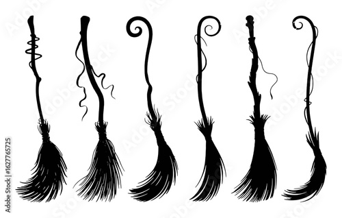 Black witch brooms with swirling handles and wispy bristles halloween magic