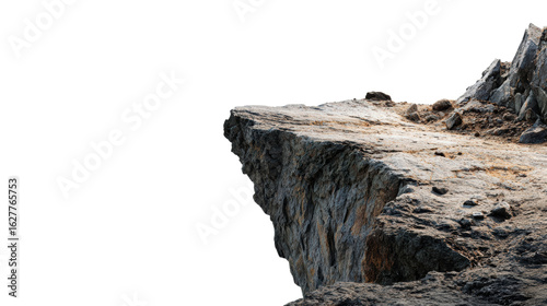 A rugged rock formation with a textured surface, set against a stark black background, emphasizing its natural contours and ruggedness.
