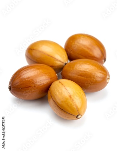 Close-up of five argan seeds