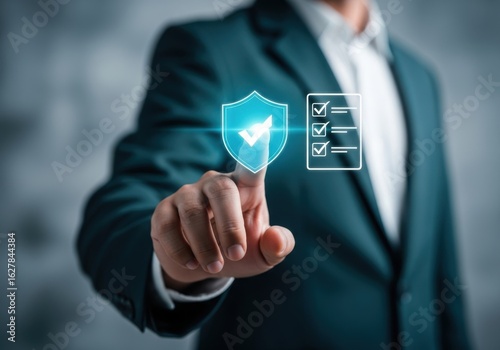 Businessman activating security shield and compliance checklist on virtual interface promoting data protection and regulatory adherence for business operations
