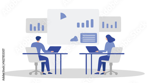Two people working on laptops at desks with charts and graphs displayed on screens behind them in an office