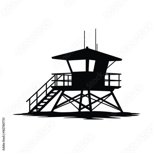 Silhouette of a classic lifeguard tower on a sandy beach