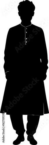 A man stands in traditional attire, including a long robe and trousers, isolated on white background