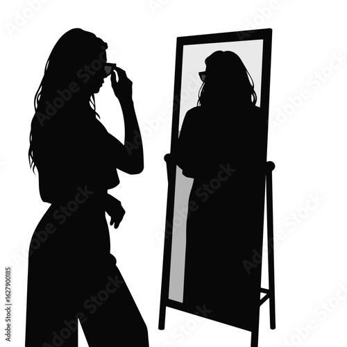 Woman trying on sunglasses in mirror, self-reflection concept