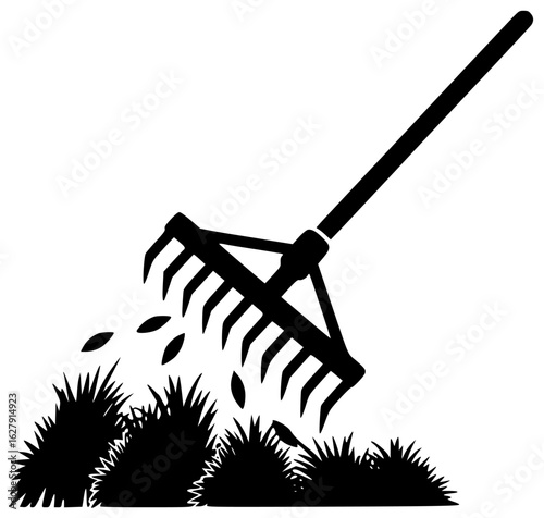 Rake agriculture tool being used to gather crops and lying on field with farmer in background near hay