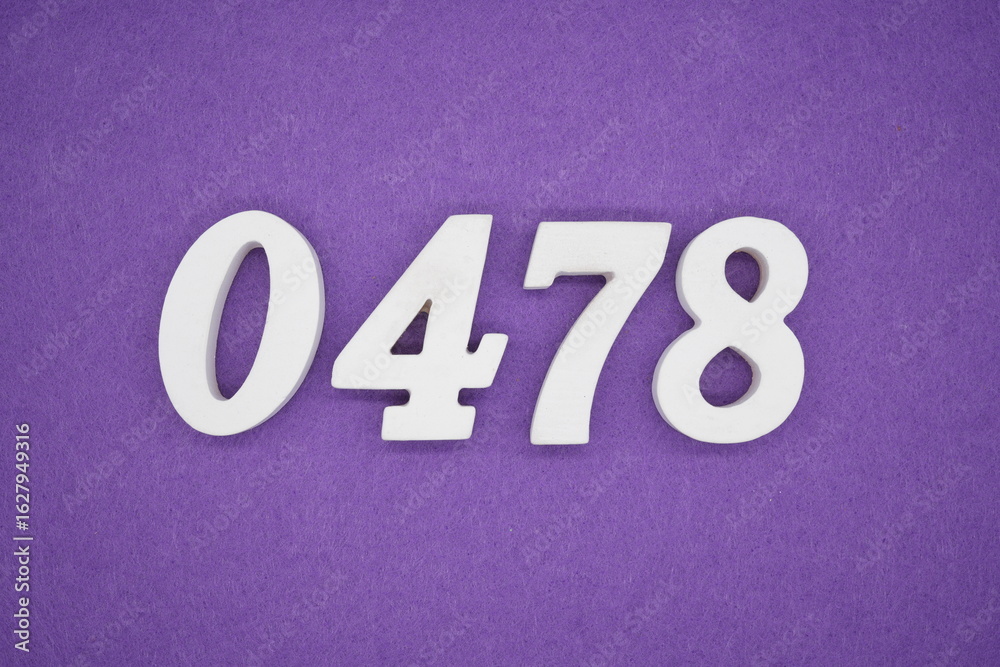 The numbers are made of white painted wood, placed on a purple paper background. The numbers are made of white painted wood, placed on a purple paper background.