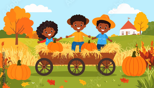 Three happy African American children on an autumn hayride in a wooden cart with pumpkins.