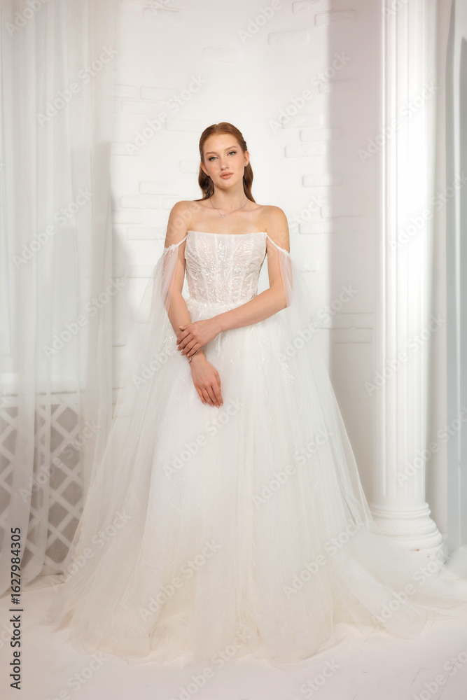 Elegant bridal portrait in a serene indoor setting during daylight highlighting a stunning gown and bridal accessories Elegant bridal portrait in a serene indoor setting during daylight highlighting a stunning gown and bridal accessories