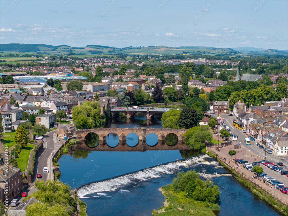 Fototapeta premium Aerial view of River Nith and weir, various bridges, Dumfries, Scotland
