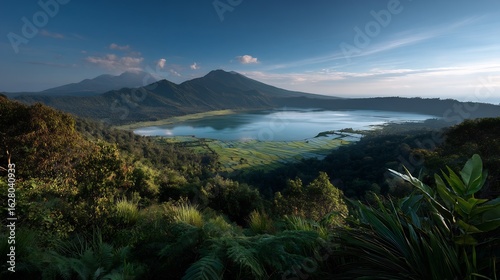 Fototapeta Naklejka Na Ścianę i Meble -  Serene mountain lake landscape with lush vegetation and rice terraces in Bali