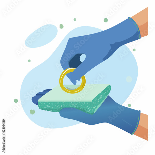 Hands wearing blue gloves cleaning a golden ring with a green sponge, illustrating hygiene and meticulous care with a clean background