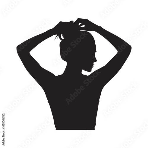 Woman s silhouette adjusting her hair with arms raised against a bright white background