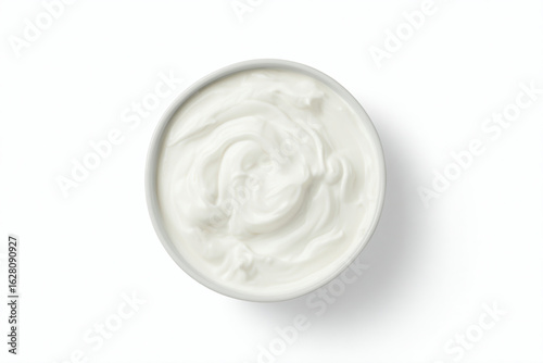 a bowl of yogurt on a white surface