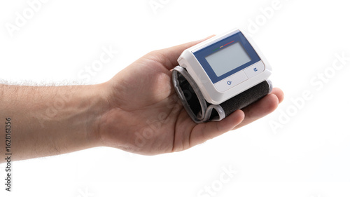 Hand with digital blood pressure monitor