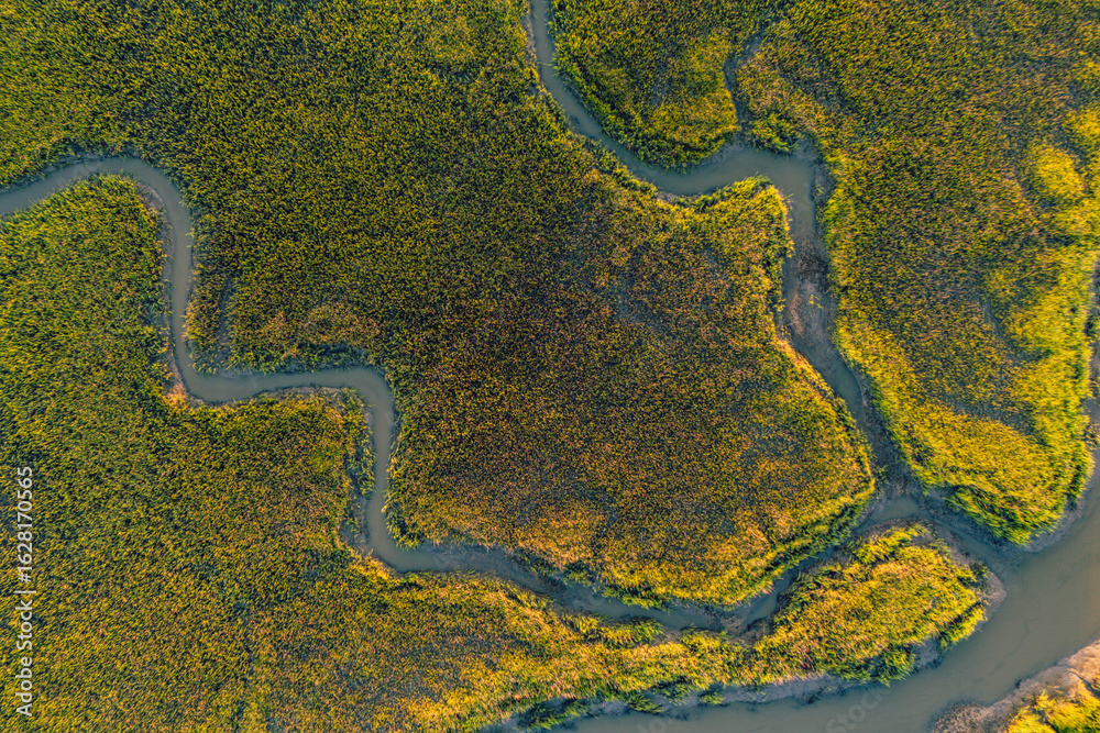 Fototapeta premium Sunset over Horseshoe Creek Marsh and Bohicket Creak