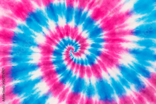 Vibrant pink and blue swirl tie dye pattern background