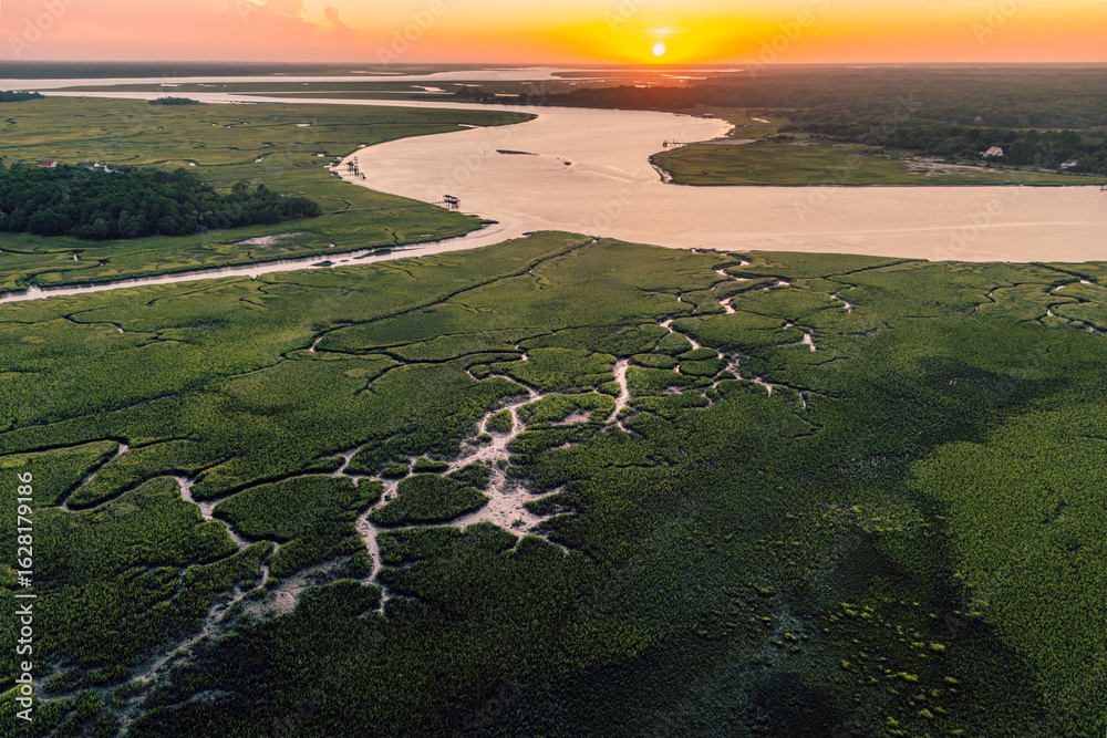 Fototapeta premium Sunset over Horseshoe Creek Marsh and Bohicket Creak