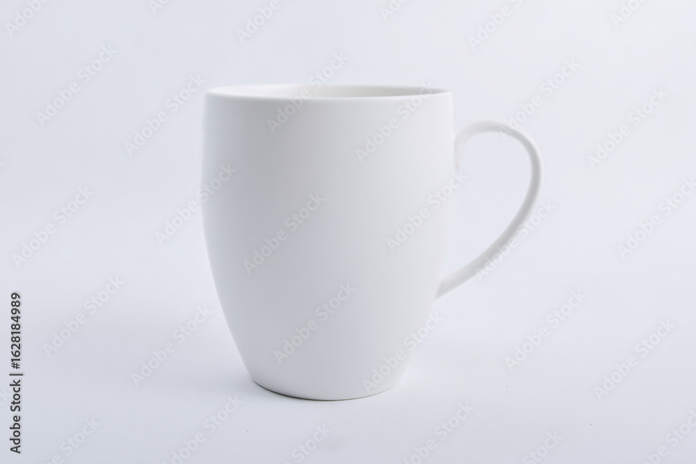 Fototapeta premium a white coffee cup sitting on a white surface